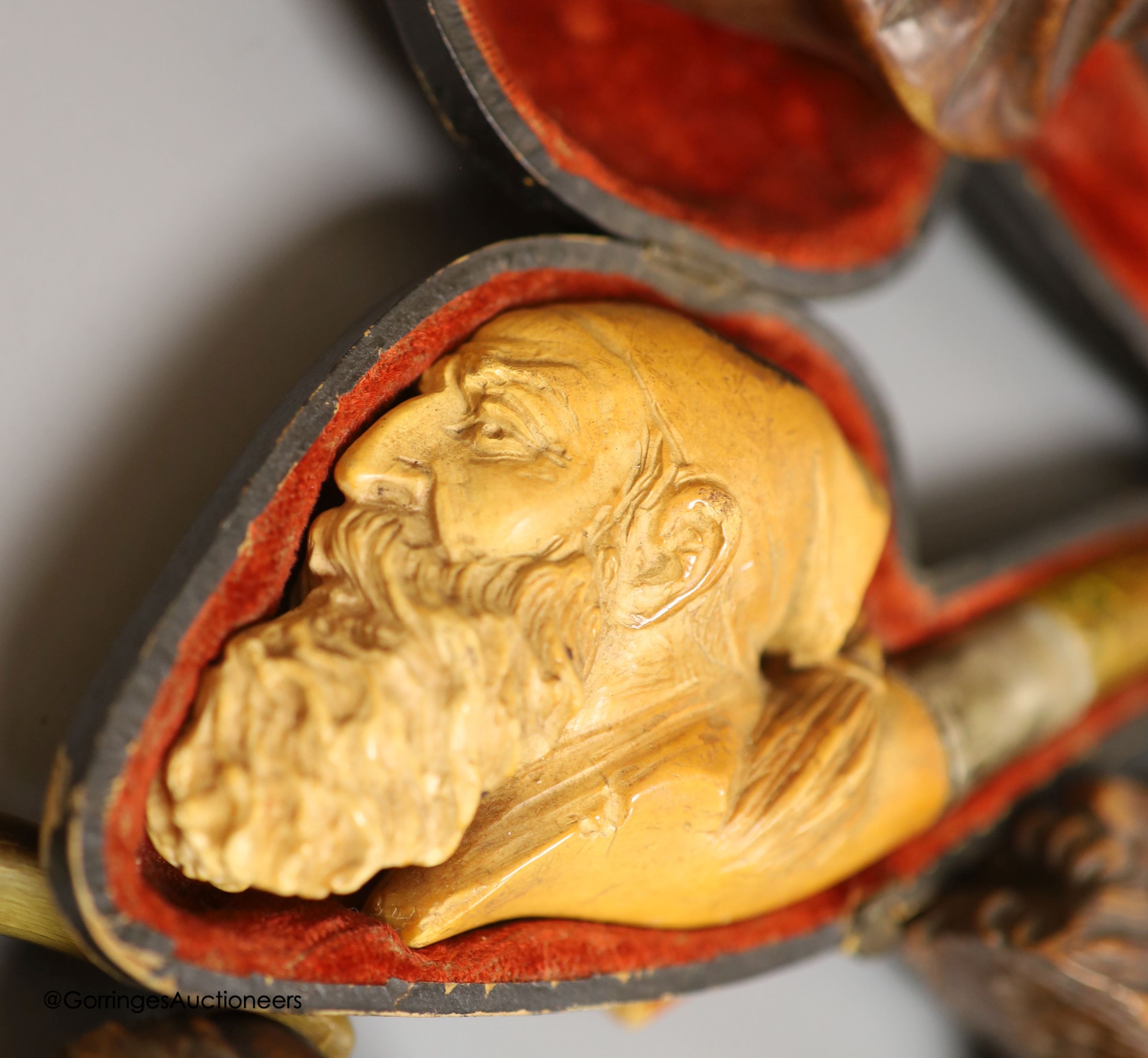 An Inuit stone bear and a collection of Meerschaum pipes